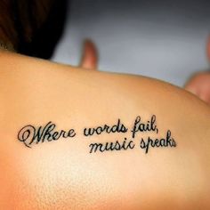 a woman with a tattoo on her shoulder that says, where words fail music speak