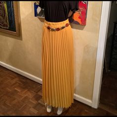 Ladies Pleated Maxi Skirt With Wide Elastic Waist Ban. Fully Lined. Belt Sold Separately. Elegant Yellow Pleated Bottoms, Elegant Yellow Skirt For Day Out, Chic Yellow Skirt With Elastic Waistband, Yellow Pleated Skirt For Day Out, White Flowy Skirt, Coral Maxi Skirts, Brown Maxi Skirts, Maxi Sequin Skirt, Green Maxi Skirt