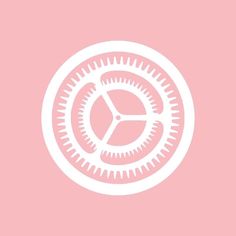 a pink background with a white circular design on the center and bottom part of it