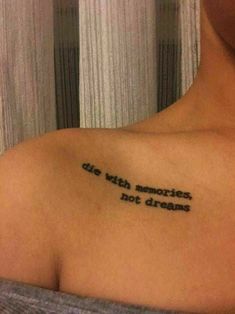 a woman with a tattoo on her shoulder that says, life with memories is not dreams