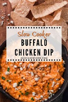 slow cooker buffalo chicken dip in a cast iron skillet with tortilla chips