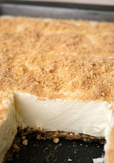 a close up of a cake in a pan with some crumbs on it