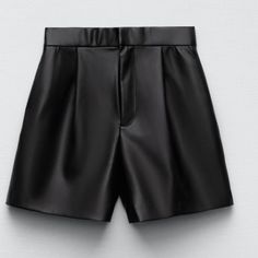 High Waisted Shorts Side Hidden Inseam Pockets And Back Welt Pockets Front Pleat Detail Front Zipper & Metal Hook Closure Faux Leather Workwear Shorts, Chic Faux Leather Short Bottoms, Elegant High-waisted Shorts For Going Out, Chic Short-length Faux Leather Bottoms, Faux Leather High-waisted Shorts For Work, Elegant Faux Leather Bottoms For Summer, Elegant Faux Leather Summer Bottoms, Elegant Faux Leather Shorts, Faux Leather High-waisted Shorts For Going Out