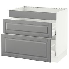 a white and gray kitchen cabinet with two drawers on each side, one drawer open