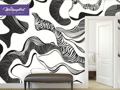 an artistic wallpaper design with black and white swirls on the walls, along with a bench