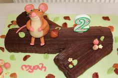 a birthday cake made to look like a mouse with the number two on it's side