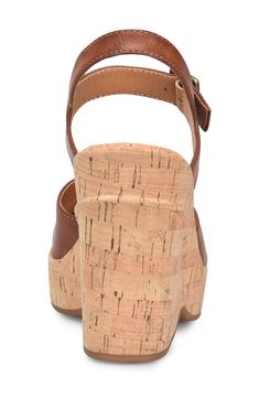 An adjustable ankle strap secures this slingback sandal lofted by a cork-inspired platform and heel. 4" heel; 1" platform Synthetic upper, lining and sole Imported Cork Wedge Sandals With Heel Strap And Round Toe, Open Toe Cork Wedge Sandals With Heel Strap, Cork Wedge Sandals With Heel Strap, Cork Sandals With Heel Strap And Wedge Heel, Cork Wedge Sandals With Removable Insole And Ankle Strap, High Heel Cork Sandals For Spring, Spring High Heel Cork Sandals, Cork Platform Open Toe Heels, Cork Platform Heels With Open Toe