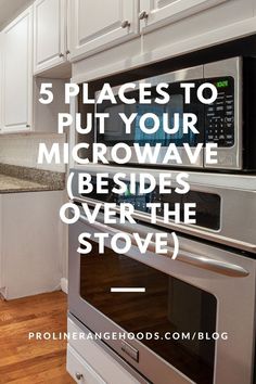 a stove top oven sitting inside of a kitchen next to white cabinets and wooden floors