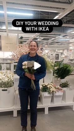 a woman standing in front of flower arrangements with the words diy your wedding with ikea