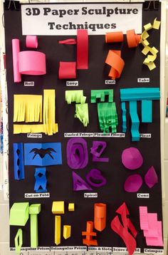 a poster with different types of paper sculptures on it's display wall in a classroom