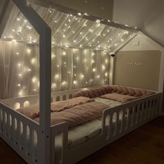 a bed that has some lights on it