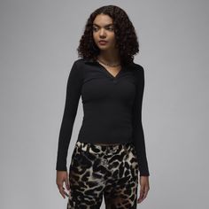 Soft, stretchy and oh-so comfortable. Made for everyday wear, this ribbed long-sleeve top gives you a confident, casual look with a body-skimming fit and V-neck design. High Stretch Casual Long Sleeve Top For Layering, Trendy Long Sleeve Top For Layering With Ribbed Detail, Trendy Ribbed Long Sleeve Top For Layering, Casual Stretch Long Sleeve Top For Work, High Stretch Ribbed Long Sleeve Tops, Ribbed Fitted Long Sleeve Top For Fall, Black Long Sleeve Top With Ribbed Neckline, Winter V-neck Elastane Top, Trendy Elastane Long Sleeve Top For Fall