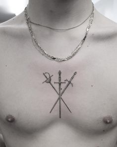 a chest with two crossed swords and an anchor tattoo on it's left side