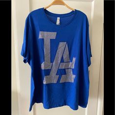 Super Sporty Dodger Over Size Tee! Wear It To The Game, Beach Or Pool! Size 2xl 100 Cotton Bella And Canvas Unisex Tee High Quality Rhinestones La Logo Turn Inside Out To Wash Cold Water Wash, Hang To Dry Do Not Iron Decoration Visit Our Website To See More Styles Www. Jadesfashions.Com Blue Graphic Print T-shirt For Loungewear, Blue Graphic Tee For Loungewear, Over Size Tee, Dodger Blue, Iron Decoration, Over Size, Iron Decor, Bling Bling, Cold Water