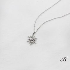 Elegant Snowflake Jewelry For Formal Occasions, Elegant Snowflake Shaped Cubic Zirconia Jewelry, Formal Diamond Snowflake Jewelry, Formal Snowflake Diamond Jewelry, Formal Snowflake Diamond White Jewelry, Diamond White Snowflake Jewelry For Formal Occasions, Elegant Christmas Diamond Jewelry, Elegant Snowflake Necklace For Formal Occasions, Elegant Snowflake Necklace For Anniversary