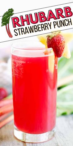 a red drink in a glass with strawberries on the side and rhubarb strawberry punch