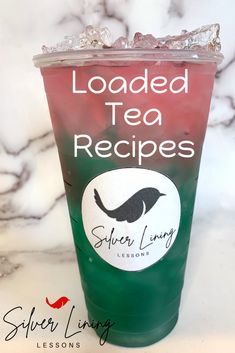 a green and red drink sitting on top of a marble counter with the words loaded tea recipes above it