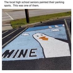 an image of a duck painted on the street in front of a parking lot that says mine