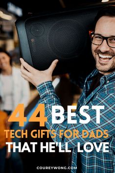 a man holding up a speaker with the words 4 best tech gifts for dads that he'll love