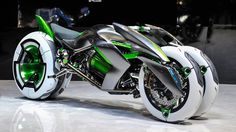 a futuristic green and white motorcycle on display