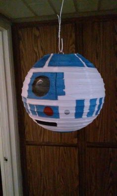 a star wars paper lantern hanging from a door