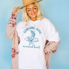 Get ready to show your style with our Cowgirl Soul Mermaid Heart T-Shirt! Perfect for a beach party, concert or or just a casual day out, this graphic tee is a must-have.  Proudly Printed on Comfort Colors® tees, for that insanely soft, vintage look and feel.  Without doubt, this will be your favorite shirt. With its vintage-inspired design, this shirt is perfect for those who love a boho, western, or retro look. The oversized fit and soft, comfortable fabric make it the perfect choice for a day Aesthetic Cowgirl, Western Stuff, Cowgirl Gifts, Mermaid Core, Coastal Aesthetic, Trendy Beach, Cowgirl Shirts, Cow Girl, Beach Shirt