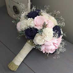 a bridal bouquet with pink and white flowers