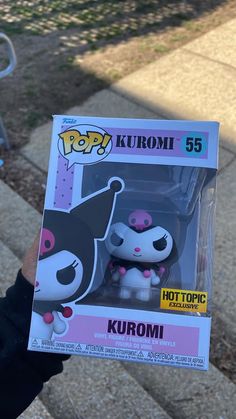 someone holding up a pop vinyl figure from the movie kuromi 55 in their hand