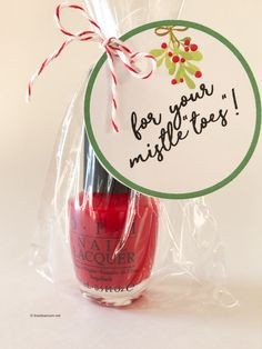 a bottle of red nail polish in a plastic bag with a tag for your mistlet - top