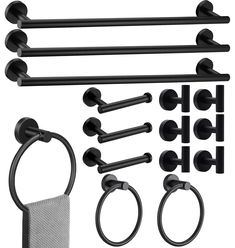 an assortment of bathroom accessories including towel rings, hooks and toilet paper holder with mesh bag