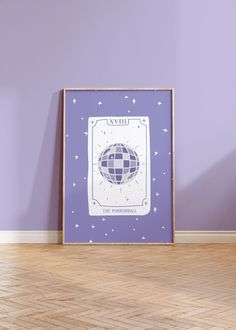 a purple wall with a blue and white poster hanging on it's side next to a wooden floor