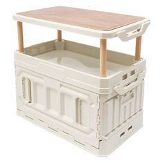 a white plastic crate with a wooden table on top