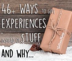 a gift wrapped in brown paper sitting on top of snow next to a wooden sign