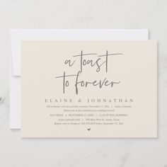 a white and gray wedding card with the words, a toast to forever on it