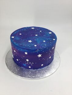 a blue cake with white stars on it