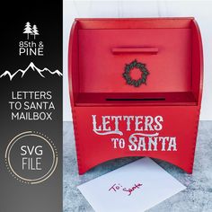 a red mailbox with the letters to santa written on it