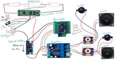 an electronic device with two speakers attached to it and some wires connected to the board