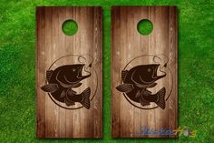 two cornhole game boards with fish on them