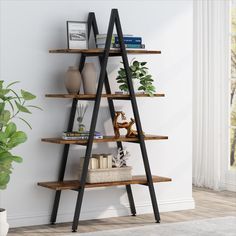 a wooden shelf with books and vases on it next to a potted plant