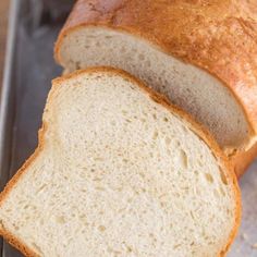 a loaf of bread sitting on top of a metal pan