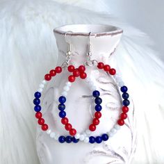 Patriotic earrings for women to celebrate Memorial day, 4th of July Independence day, Flag day, Veterans day and any other special holiday you would like. These red white and blue hoop earrings are fun and festive.  Red white and blue earrings are made with small coral red beads, white faceted glass, and blue howlite beads. These patriotic earrings hang almost 2 inches. Wear these beautiful earrings to a special formal event or dress them down for a more casual look. Earrings are READY TO SHIP!! Fourth Of July Jewelry, American Flag Jewelry, Patriotic Earrings, Extra Long Necklace, Patriotic Jewelry, Holiday Earrings, Bead Ideas, Long Beaded Necklace, Holiday Earring