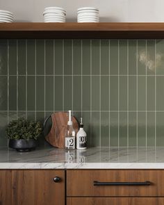 the kitchen counter is clean and ready to be used for cleaning dishes, cups, and utensils