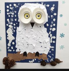 an owl made out of paper and some pine cones