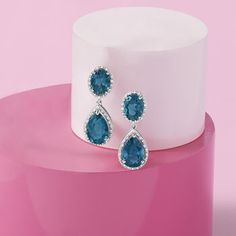 Ross-Simons - 11.00ct t. w. London Blue Topaz, .14ct t. w. Diamond Drop Earrings. For an extra fancy touch of sparkle and color, slip on these extravagant drop earrings in sterling silver. Ovals and pear shapes of 11.00 ct. t. w. London blue topaz are highlighted by .14 ct. t. w. diamond frames. Hanging length is 1 1/8". Post/clutch, diamond and blue topaz drop earrings. Blue Topaz birthstones are the perfect gift for December birthdays. Elegant Turquoise Diamond Earrings, Elegant Blue Pear-shaped Diamond Earrings, Formal Blue Pear-shaped Diamond Earrings, Blue Pear-shaped Diamond Earrings For Anniversary, Formal Sapphire Crystal Earrings, Elegant Turquoise Jewelry With Brilliant Cut, Dazzling Blue Earrings With Diamond Accents, Formal Blue Diamond Earrings, Formal Blue Diamond Earrings For Pierced Ears