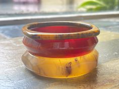 3 vintage Tested Bakelite Bangles Marbled Vintage Lot of 3 All 3 bracelets are included Tested bakelite Measures 7.5" inside circumference  Excellent condition, no flaws to note Very cool original vintage bakelite jewelry from the 1940s See pictures for additional details Vintage Amber Bangle Bracelet, Handmade Round Bakelite Jewelry, Handmade Bakelite Bangle Bracelet, Vintage Lucite Bangle Bracelet, Handmade Bakelite Bracelets As Gift, Vintage Stackable Round Bracelets, Bracelets Vintage, Jade Bead Necklace, Bakelite Jewelry