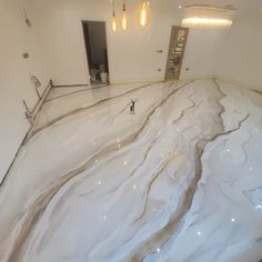 an empty room with white walls and flooring that has been painted to look like marble