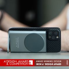 an image of a camera on a table with the words design award and competition written below it