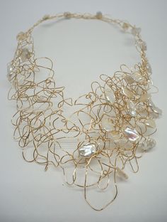 Handmade 14k Gold Fill Wire Wrap architectural necklace with White Keshi Pearls.  The necklace has front closures that allow the wearer to reshape the necklace to create symmetrical or asymmetrical shapes. Unique Freeform Gold Necklace, Elegant Freeform Necklace For Gifts, Elegant Necklace For Gift, Architectural Necklace, Baroque Pearls Jewelry, Wire Wrap Necklace, Wrap Necklace, Elsa Peretti, Wire Wrapped Necklace