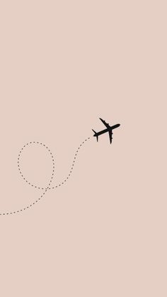 an airplane is flying in the sky with a dotted line on it's side