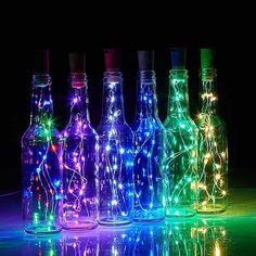 bottles with lights in them are on display for $ 19 98 at ebay